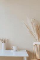 A white table with a chair and a plant photo