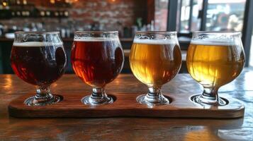 Three different types of beer are on a wooden tray photo