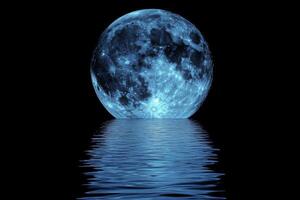A blue moon is reflected in the water photo