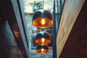 Three light bulbs hanging from the ceiling in a building photo