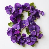 The letter b made of purple flowers on a white background photo