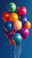 Many colorful balloons are floating in the air photo