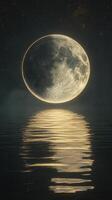 The moon is reflected in the water at night photo