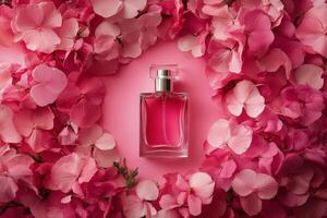 A perfume bottle surrounded by pink flowers photo