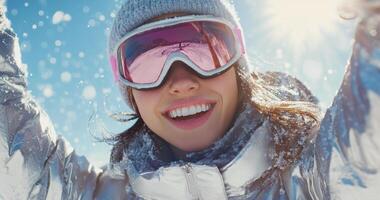 A woman in a ski mask and goggles is smiling photo