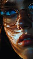 A woman with glasses and blue eyes photo