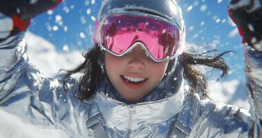 A woman in ski goggles is smiling in the snow photo