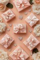 Various pink gift boxes with bows and hearts on a pink background photo