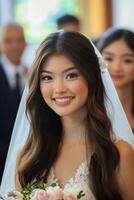 A beautiful bride smiles as she walks down the aisle photo