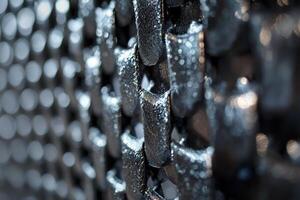 A close up of a metal mesh with holes photo