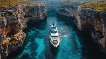 A boat is traveling through a narrow canyon photo
