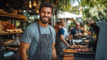 A smiling man standing in front of a grill with food photo