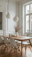 A dining room with white chairs and a wooden table photo