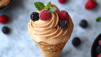 An ice cream cone with chocolate frosting and berries photo