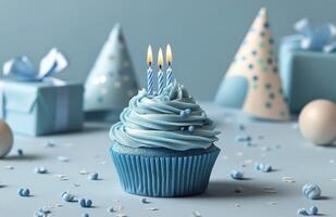 Blue birthday cupcake with candles on top photo