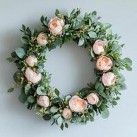 Pink peony wreath on white background photo