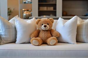 A teddy bear sitting on a couch photo