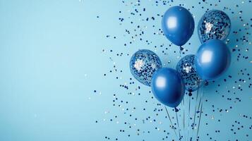 Blue balloons and confetti on a blue background photo