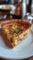 A slice of quiche on a white plate photo