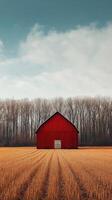 A red barn in the middle of a field photo