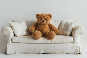 A teddy bear sitting on a couch photo