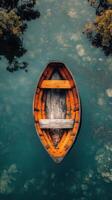 An old wooden boat floating in the water photo