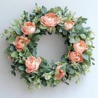 A wreath with pink peonies and eucalyptus leaves photo