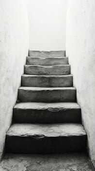 Black and white photograph of stairs in a white building photo