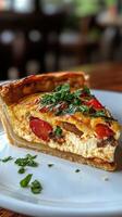 A slice of quiche on a white plate photo
