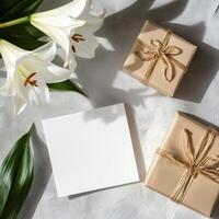 Gift boxes and white lily on a white background photo