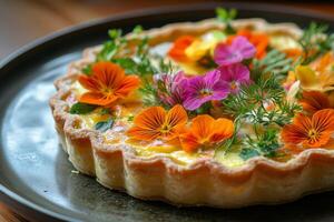 A plate with a quiche with flowers on it photo