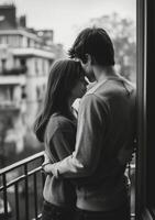 A black and white photo of a couple embracing