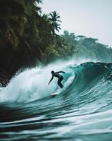 A surfer riding a wave in the ocean photo