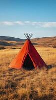 A red tent in a field photo