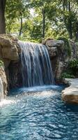 A waterfall in a backyard with a pool photo