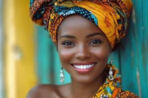Beautiful african woman smiling with colorful head wrap photo