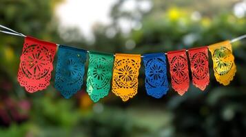 Colorful paper flags hanging on a string photo