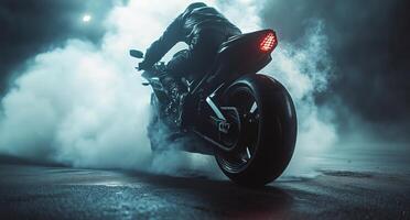 A person riding a motorcycle in the dark with smoke photo
