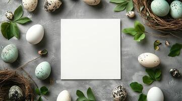 Easter eggs and paper on concrete background photo