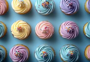 A group of cupcakes with frosting and sprinkles photo