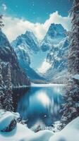 A beautiful winter landscape with snow covered mountains and a lake photo
