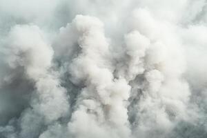A large cloud of smoke is seen in the sky photo