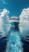 A cruise ship in the ocean with clouds in the background photo