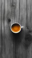 A cup of tea on a wooden table photo