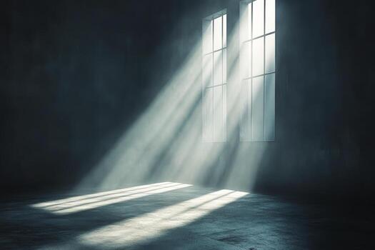 A dark room with a window and sunlight streaming through it photo