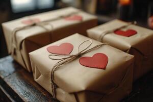 Three wrapped presents with hearts on them photo