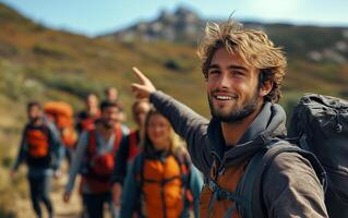 A man with a backpack is pointing at something photo