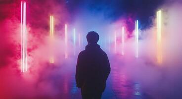 A man standing in front of colorful neon lights photo