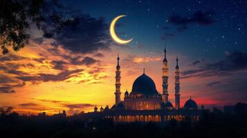 The moon and a mosque are seen in the sky at sunset photo