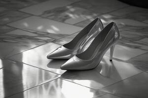 A pair of high heels on a marble floor photo
